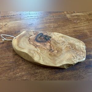 handcrafted olive wood cutting board,  use as a cheese or charcuterie board.